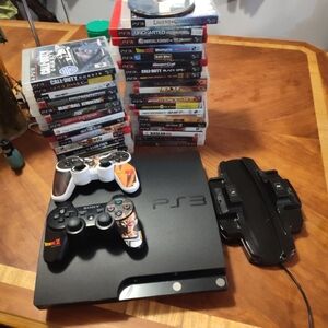 PS3 console with charger part 2 controllers with 35 games
